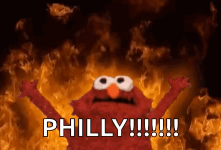 Elmo From Sesame Street Is Screaming In Front Of A Fire And The Words Philly !!! GIF