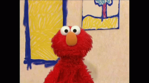 Elmo From Sesame Street Is Standing In Front Of A Drawing On The Wall GIF