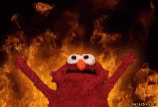 Elmo From Sesame Street Is Standing In Front Of A Fire With His Arms Outstretched GIF