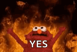 Elmo From Sesame Street Is Standing In Front Of A Fire With His Arms Outstretched . GIF