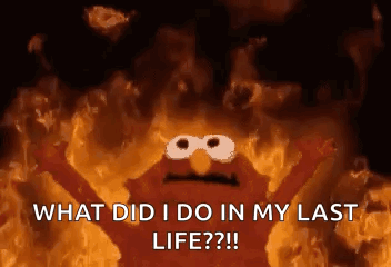 Elmo From Sesame Street Is Surrounded By Flames And Is Asking What Did I Do In My Last Life ? GIF