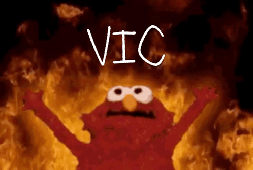 Elmo From Sesame Street Is Surrounded By Flames And The Word Vic Is Written Above Him GIF