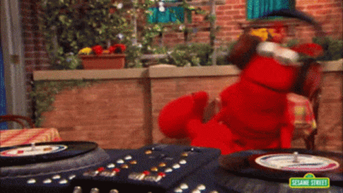 Elmo From Sesame Street Playing A Record On A Turntable GIF