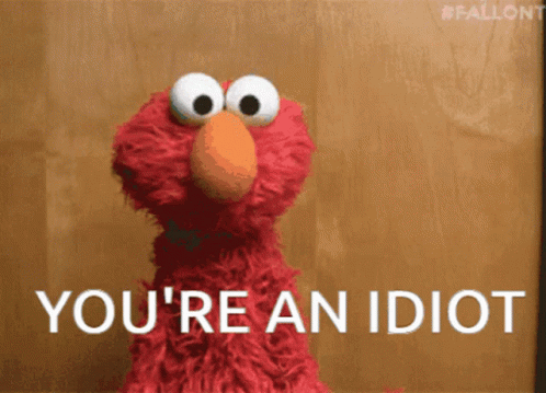 Elmo From Sesame Street Says " You 'Re An Idiot " In White Letters GIF