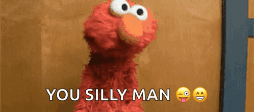 Elmo From Sesame Street Says " You Silly Man " In Front Of A Brown Wall GIF