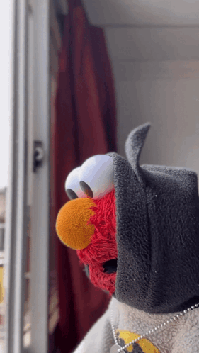 Elmo From Sesame Street Wearing A Batman Costume GIF