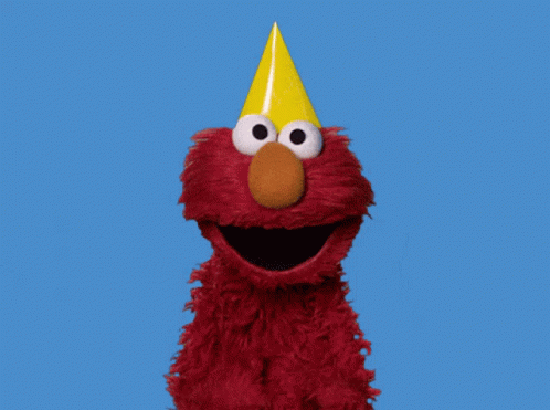 Elmo From Sesame Street With His Mouth Open Against A Blue Sky GIF