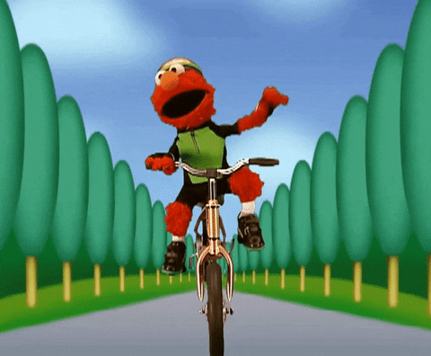 Elmo Happily Biking GIF