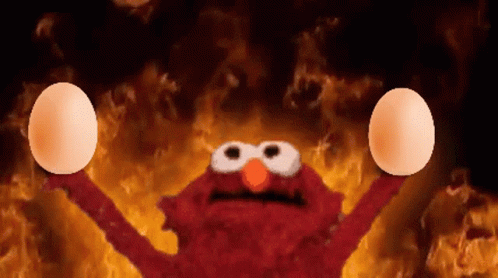 Elmo Holding Eggs in Front of Flames