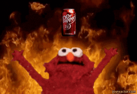 elmo is holding up his arms in front of a dr pepper can