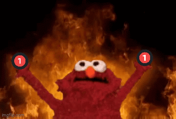 Elmo Is Holding Up Two Red Circles With The Number 1 On Them In Front Of A Fire GIF