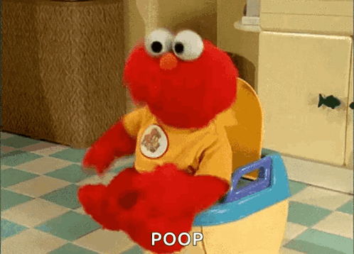 Elmo Is Sitting On A Potty With The Word Poop Written On It . GIF