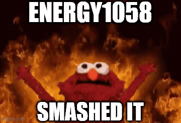 Elmo Is Standing In Front Of A Fire With The Words Energy 1058 Smashed It . GIF