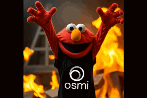 Elmo Is Wearing A Black Shirt With The Osmi Logo On It GIF