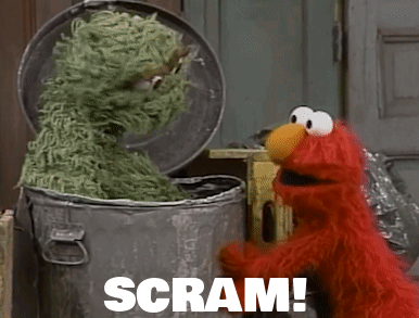 Elmo Next to Trash Can Saying Scram