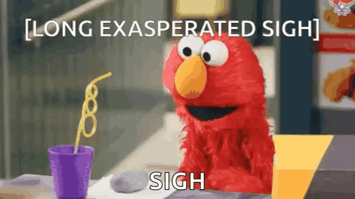 Elmo Sitting Drinking From Purple Cup