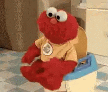 Elmo Sitting on Toilet