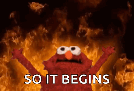 Elmo Standing Before Fire So It Begins