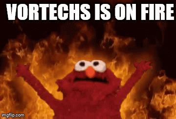Elmo Standing In Front Of Fire Saying Vortechs Is On Fire GIF