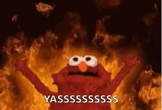 Elmo Standing in Front of Fire With Arms Up