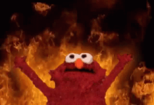 Elmo Standing in Front of Flames