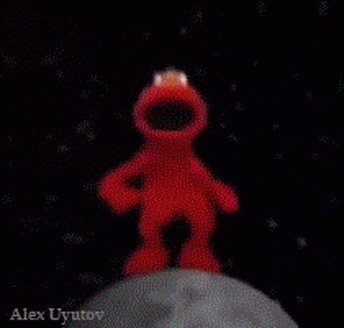 Elmo Standing on Moon Holding Planet