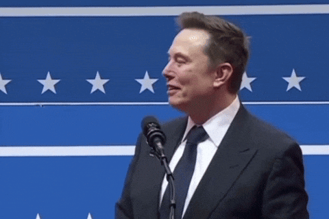 Elon Musk Speaking Into Microphone With Eyes Closed