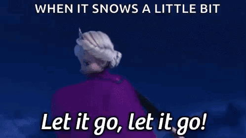 Elsa From The Movie Frozen Is Holding A Snowflake In Her Hand . GIF