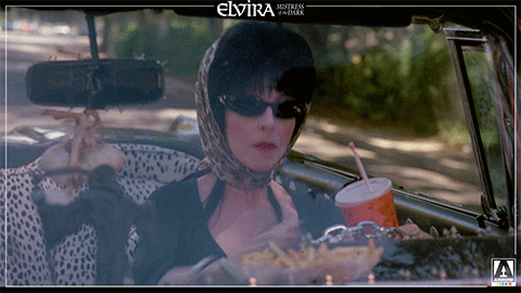 Elvira Cheering While Driving GIF