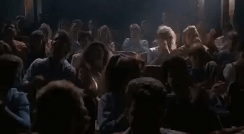 Elvira On Stage With A Spotlight GIF