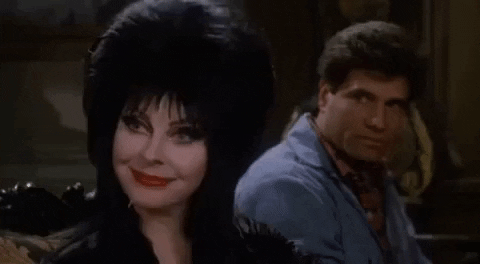 Elvira Sitting Next To Bob Redding GIF