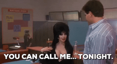 Elvira Talking To A Bob Redding GIF