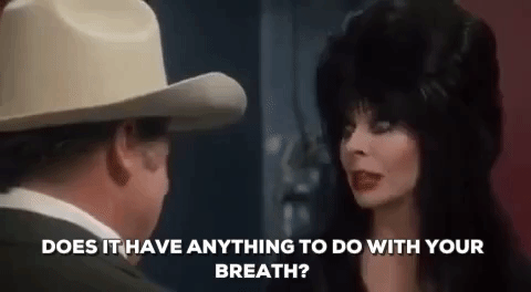 Elvira Talking To A Man GIF