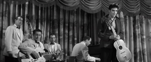 Elvis Destroying Guitar Off Stage Film Clip GIF