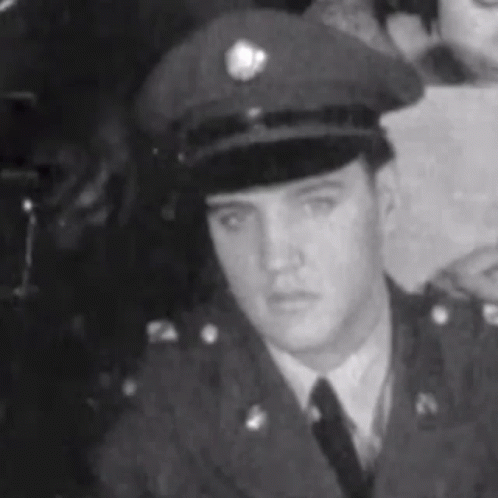 Elvis Presley in Black and White Military Uniform and Hat