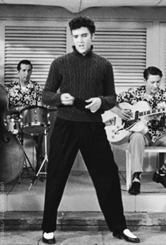 Elvis Presley Is Dancing In Front Of A Band GIF