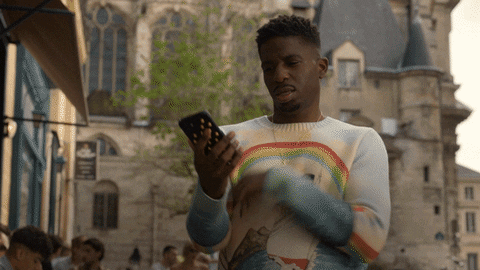 Emily In Paris Answering Phone Call GIF