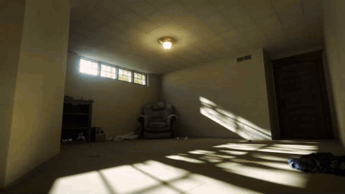 Empty Room With Chair and Light On