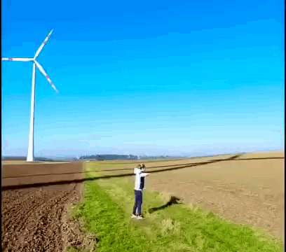 Entertaining Man Playing Windmill Shadow GIF