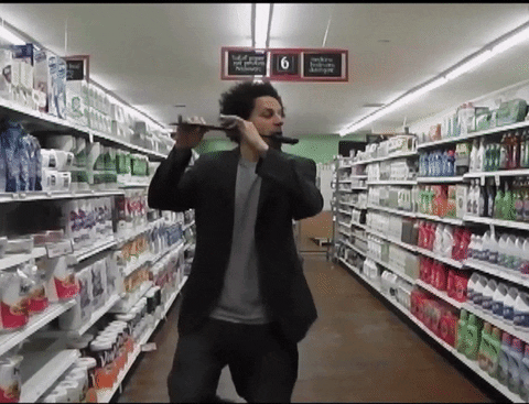 Eric Andre Let Me In Flute In Grocery GIF