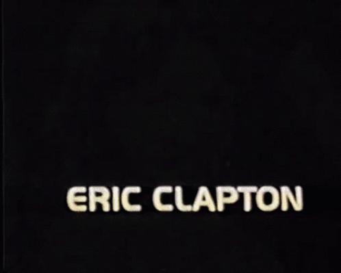 eric clapton 's face is shown in a black and red background