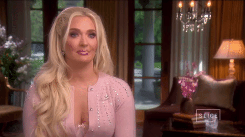 Erika Jayne Nonchalant Shoulder Brush GIF