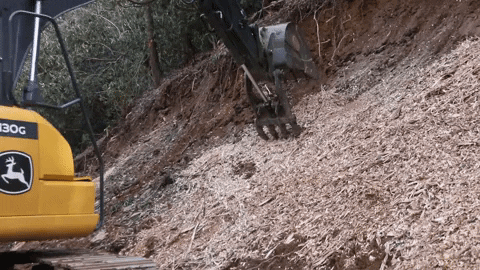 Excavator Claw Attempting To Get Mulch GIF