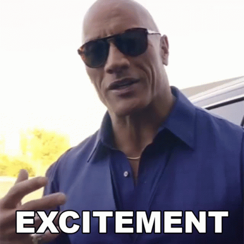 Excited Bald Man in Sunglasses and Blue Shirt