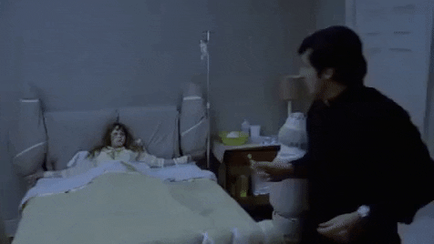 Exorcist Spraying Holy Water Cross GIF