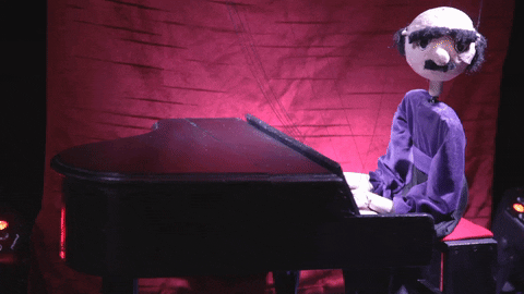 Eyebrows Raise Perfoming Puppet Show GIF