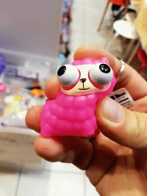 Eyes Popping Out Pink Toy GIF