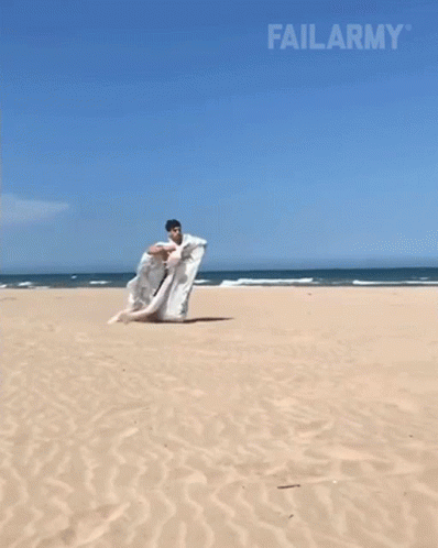 Funny Sack Race Beach Faceplant GIF