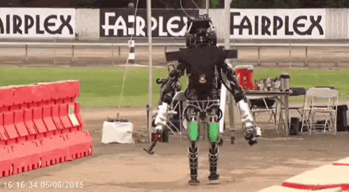 Fairplex Sign Behind Robot On Race Track GIF