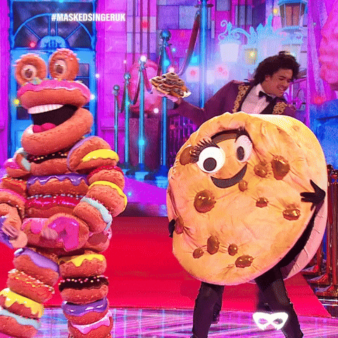 Famous Amos Cookie Mascot Dancing On Stage GIF